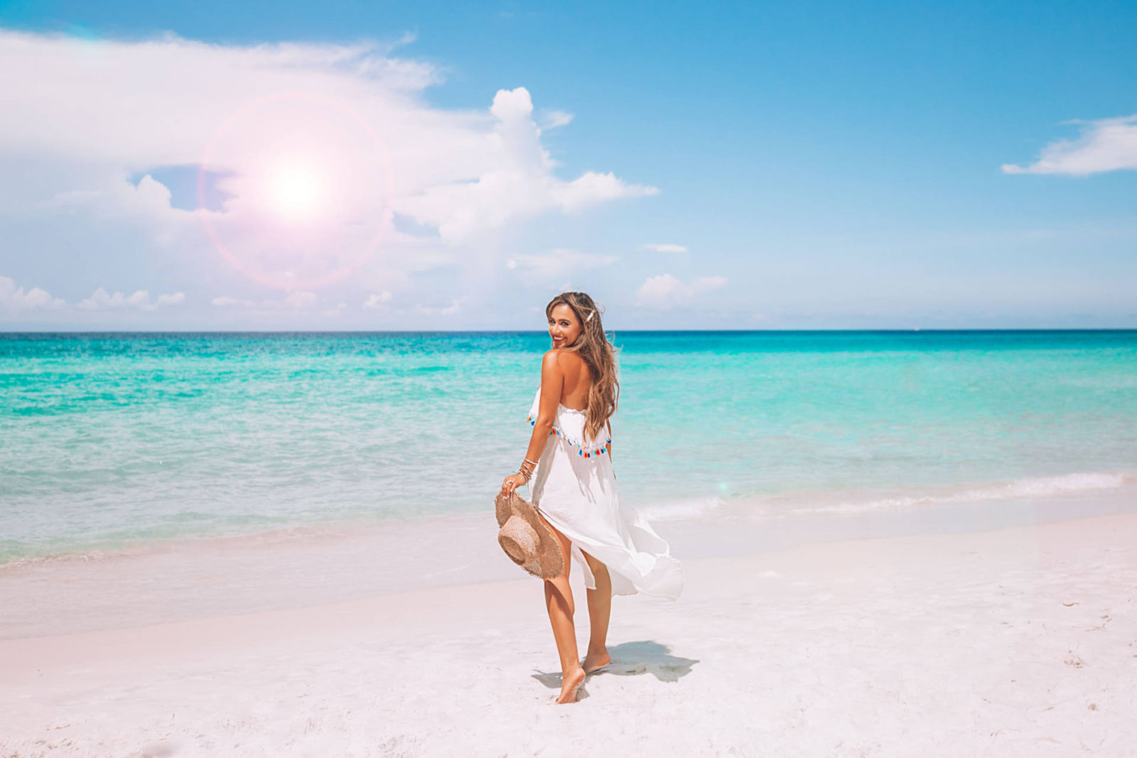 jasmine elias boswell, on the beach in panama city beach florida, maxi dress and lack of color hat