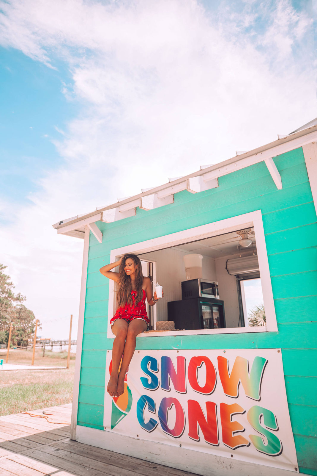 enjoying a snow cone at the beach in florida